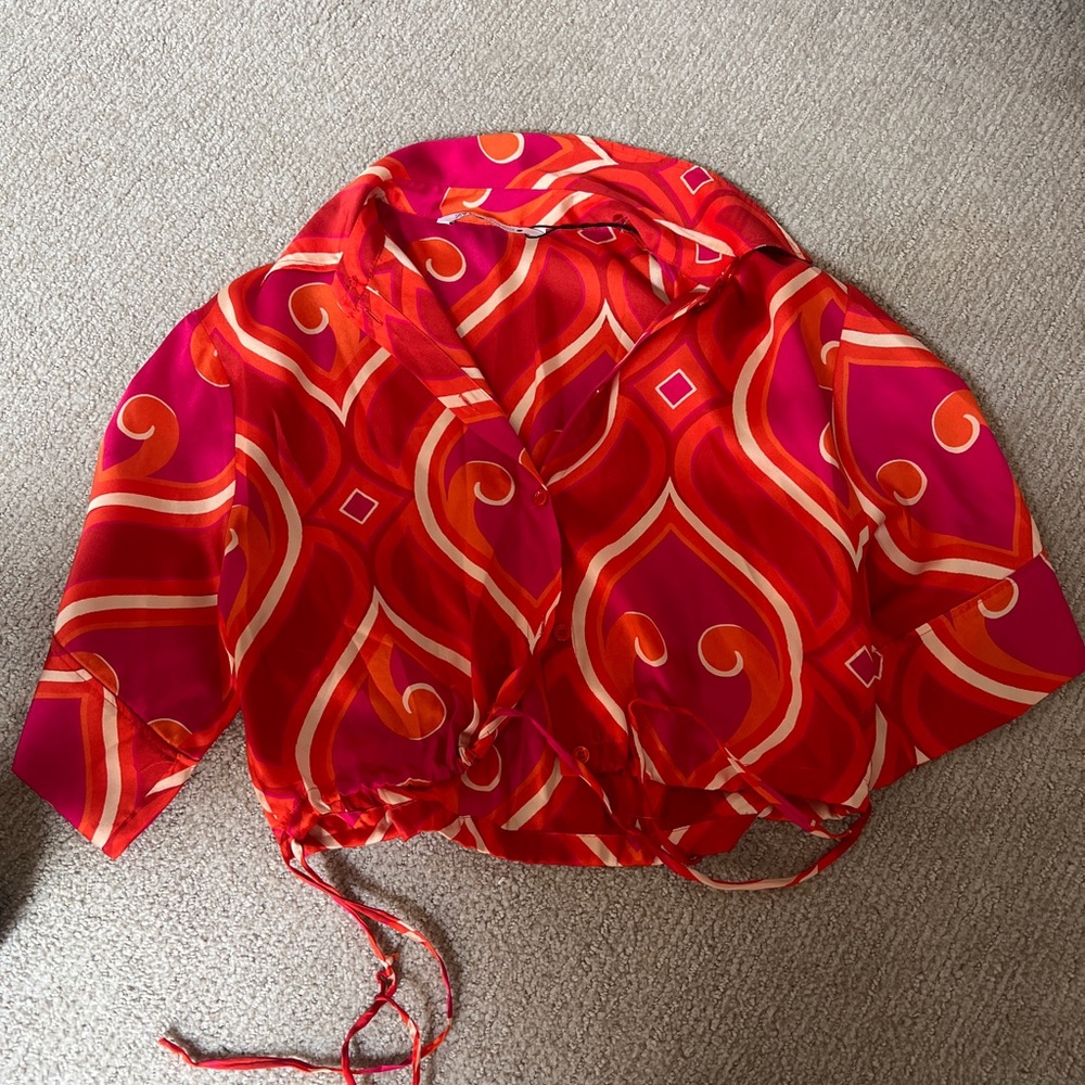 Vibrant Red and Orange Patterned Blouse